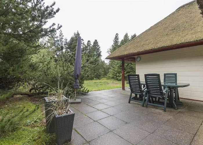 With Thatched Roof And Calm Blåvand